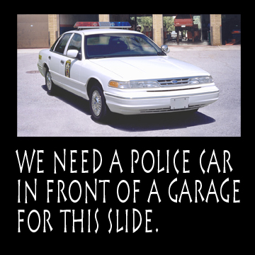   Cars in New Places -- Put a police car in front of the garage    